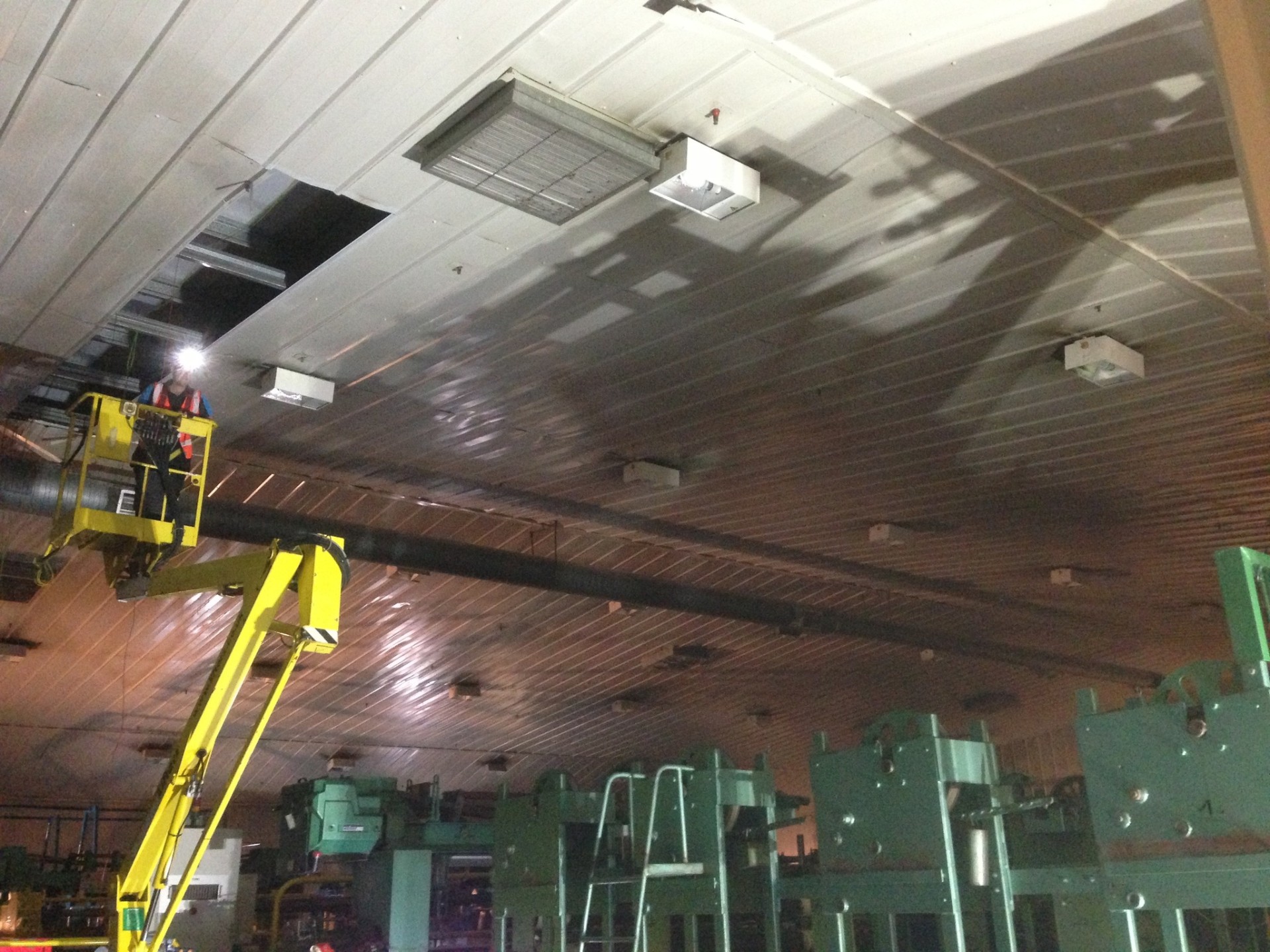 Factory ceiling LED lighting retrofit using cherry picker access