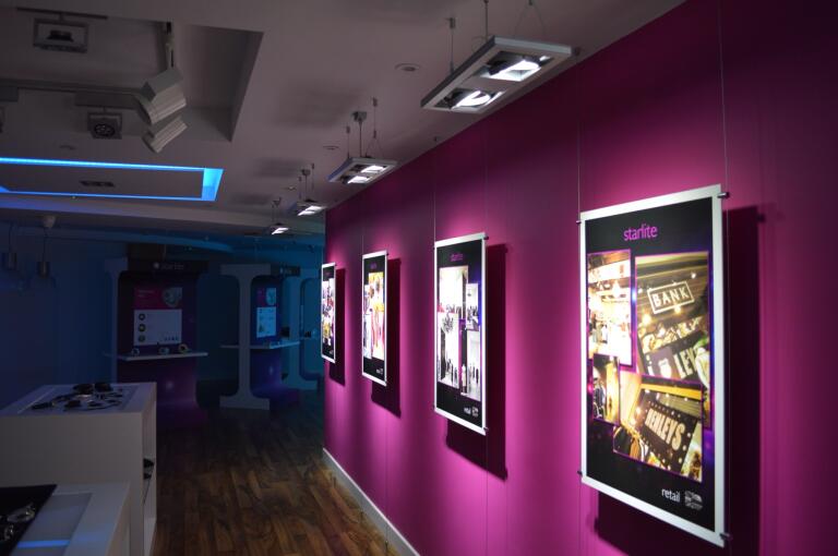 Retail store lighting fit-out with feature wall and accent spots